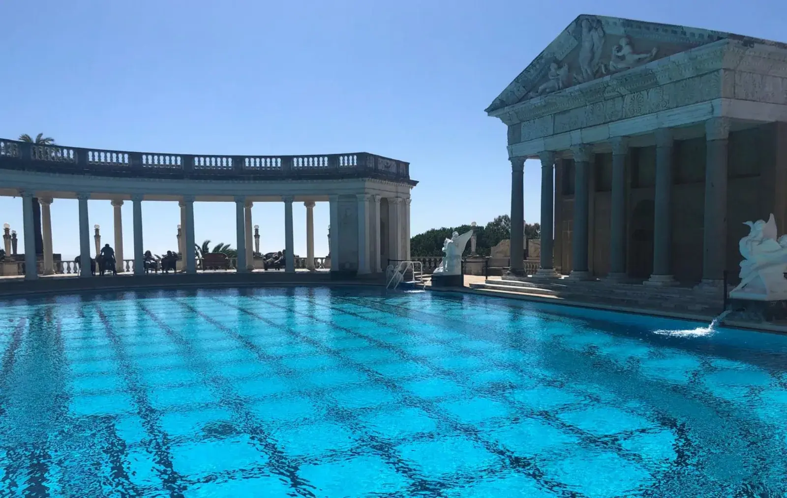 The blue Neptune Pool and classical colonnades at Hearst Castle
